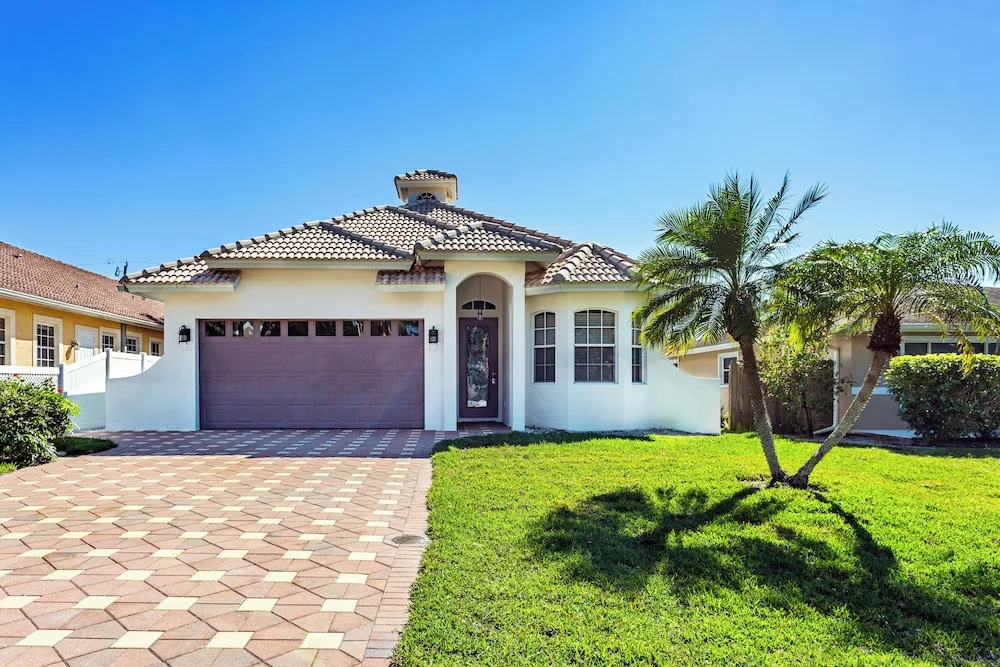 photo 1 of Imola: Newly Remodeled Pool Home Minutes from Vanderbilt Beach. Family-Friendly Retreat with 4 BR, 3.5 Bathrooms, and Private Screened Pool. Perfect Location Near Mercato and Naples Attractions