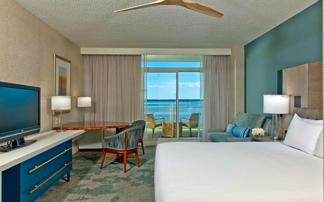 Room with balcony and with water view