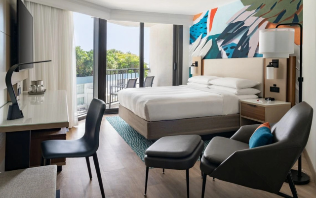 Room with balcony and with pool view