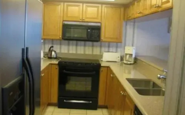 photo 3 of Luxurious Condo with Pool and Hot Tub Just a Walk to the beach by RedAwning
