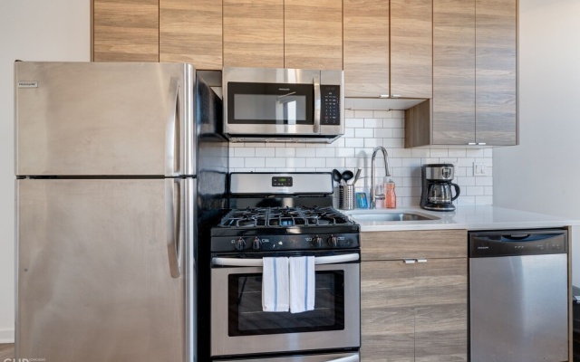 photo 3 of Wind Down After A Long Day In The Windy City - Full Kitchen, Spa Bath, Comfy Bed - 747 Lofts Cabin 202 by RedAwning